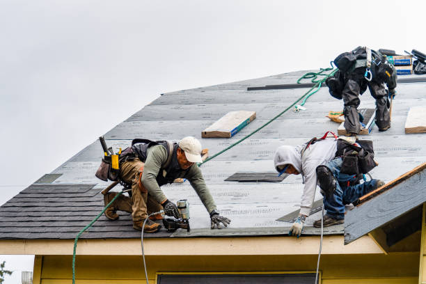 Professional Gutter Installation technician working in Quincy, MA